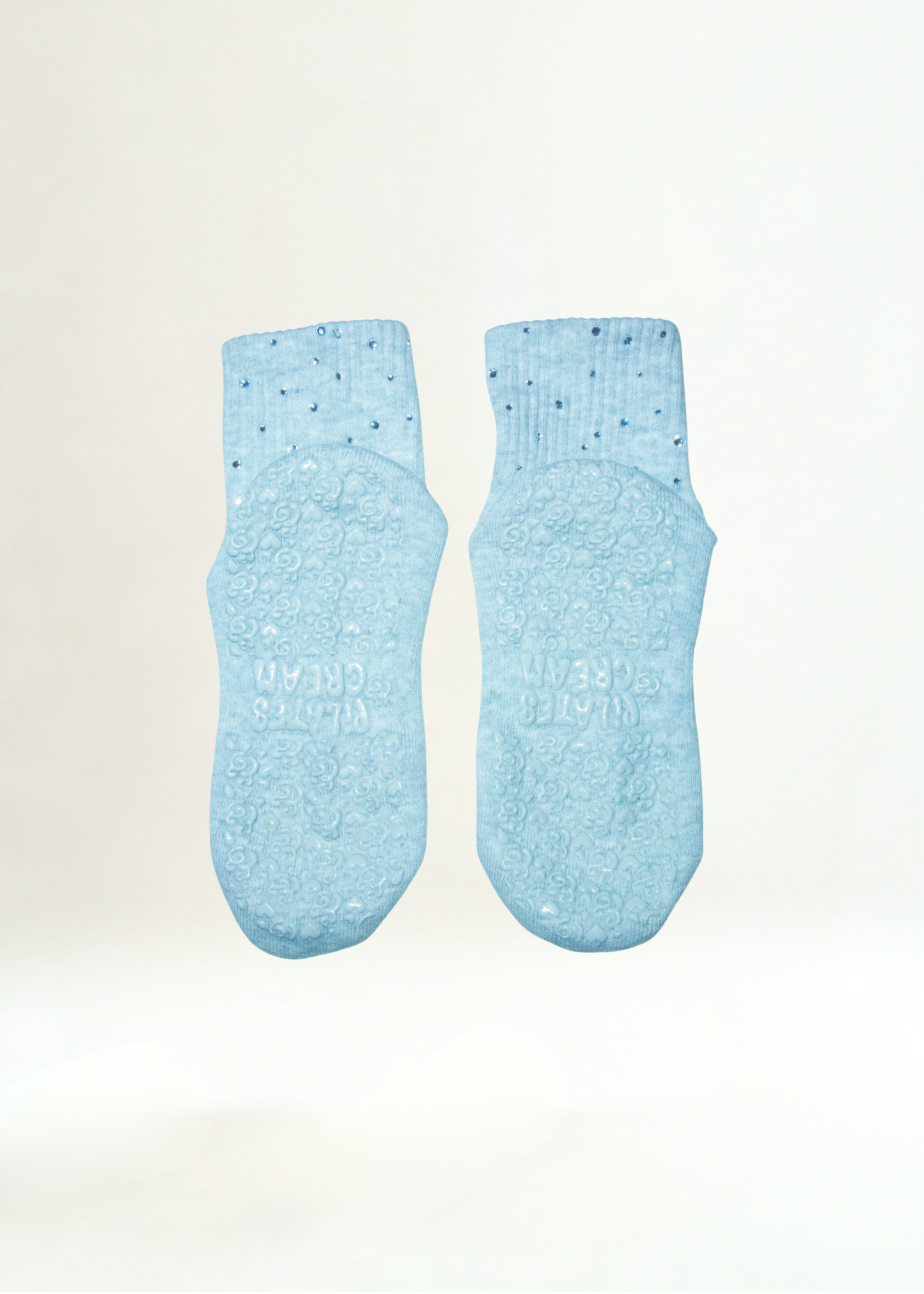 The Rihanna black Pilates grip socks — styled flatlay by Pilates & Cream