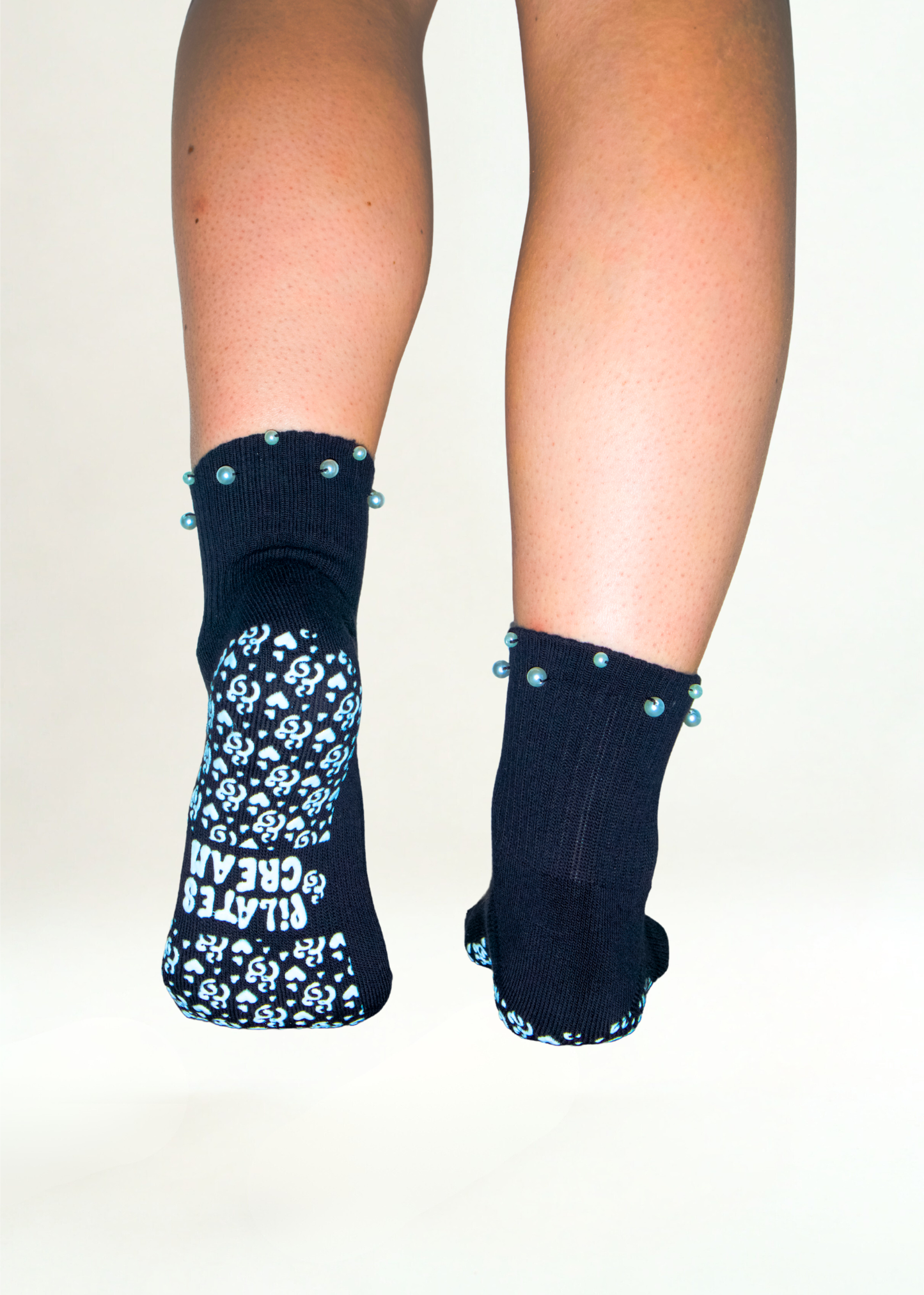 The Marilyn pearl Pilates grip socks — styled flatlay by Pilates & Cream