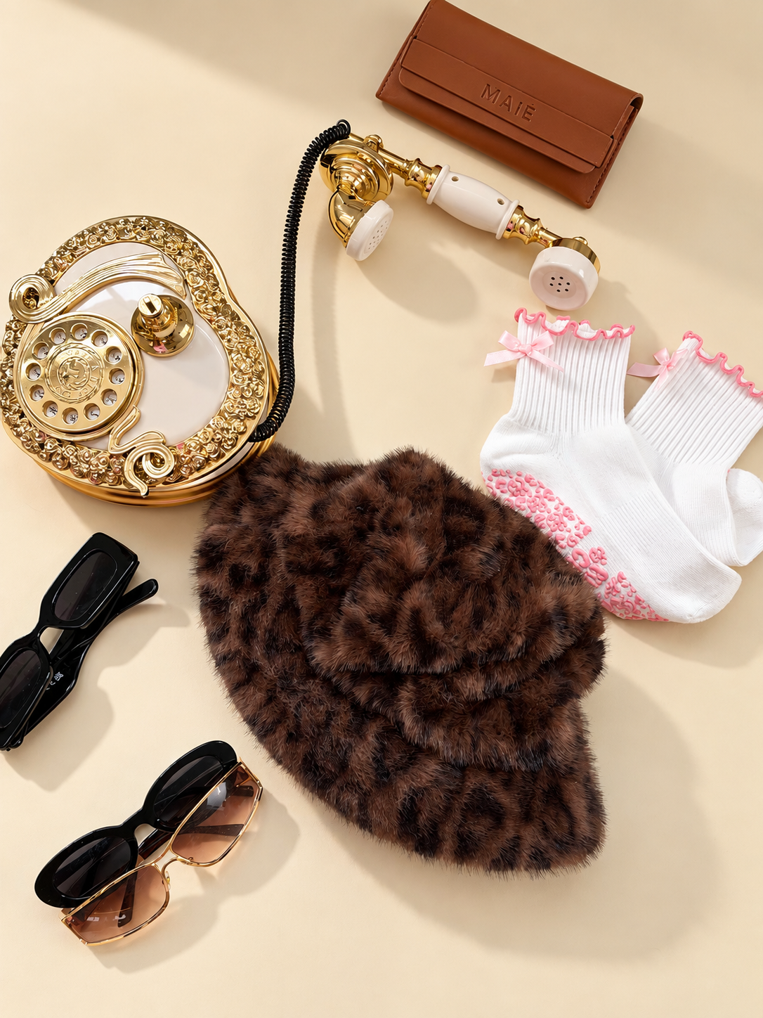 Pink fashion grip socks with red trim styled over burgundy lace tights and black loafers